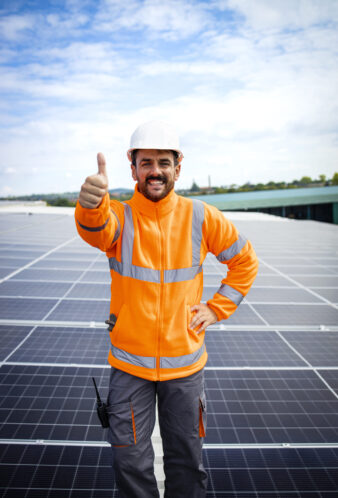 Installation of solar panels and professional worker holding thumbs up.